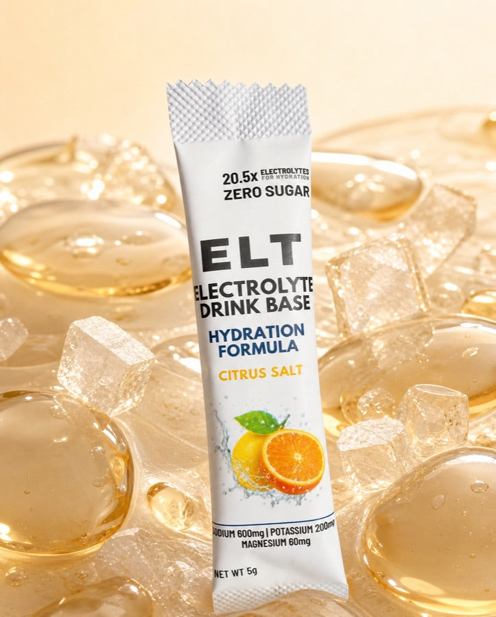 ELT sachet resting on a bed of glossy water droplets, ice and salt crystals