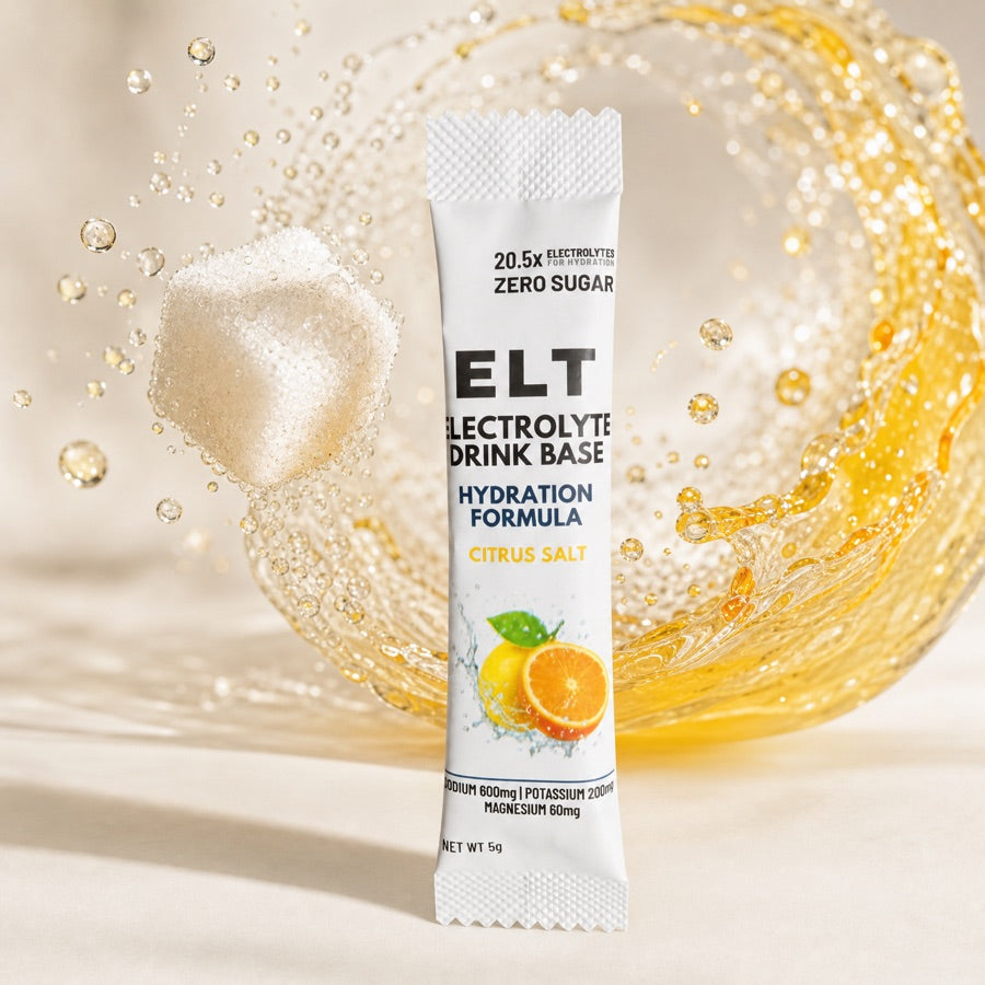 ELT sachet in front of a sugar cube dissolving into a honey-lemon splash