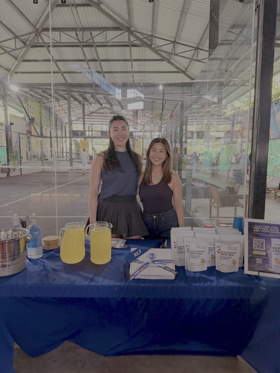 Yuli and Shyanne, the founders of ELT, sampling the drink at an event