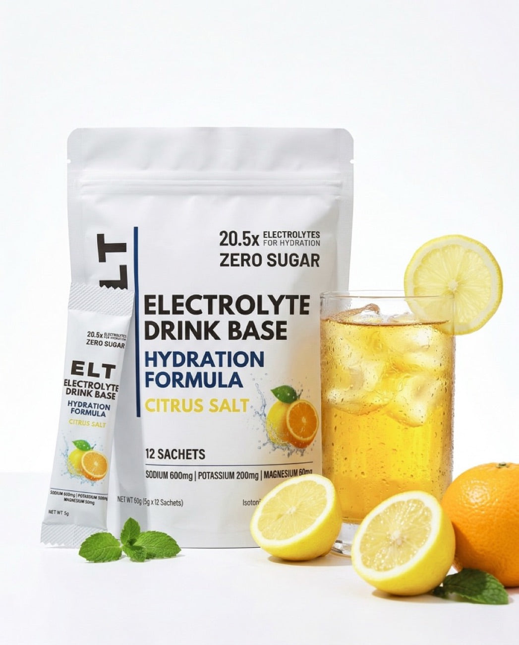 ELT citrus salt electrolyte sachets and a glass of mixed drink on a table