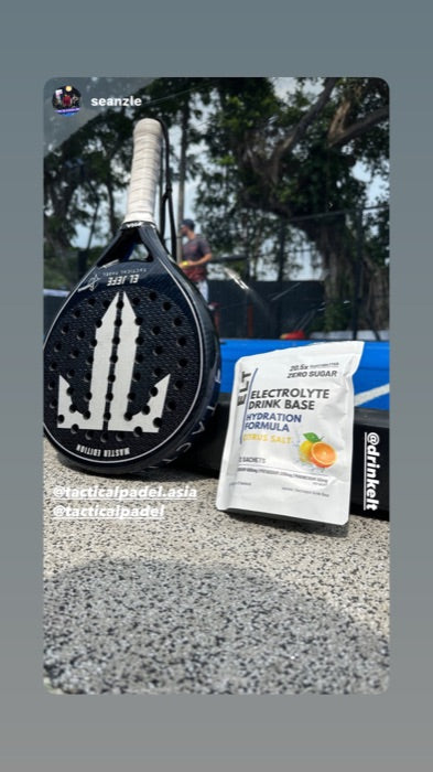 Padel racket and ELT sachet on court