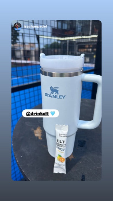 Court bottle and ELT sachet on the blue court